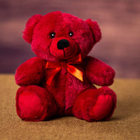A red bear that is 6 inches tall while sitting