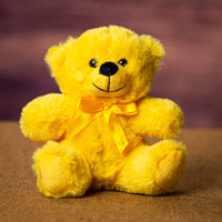 A yellow bear that is 6 inches tall while sitting