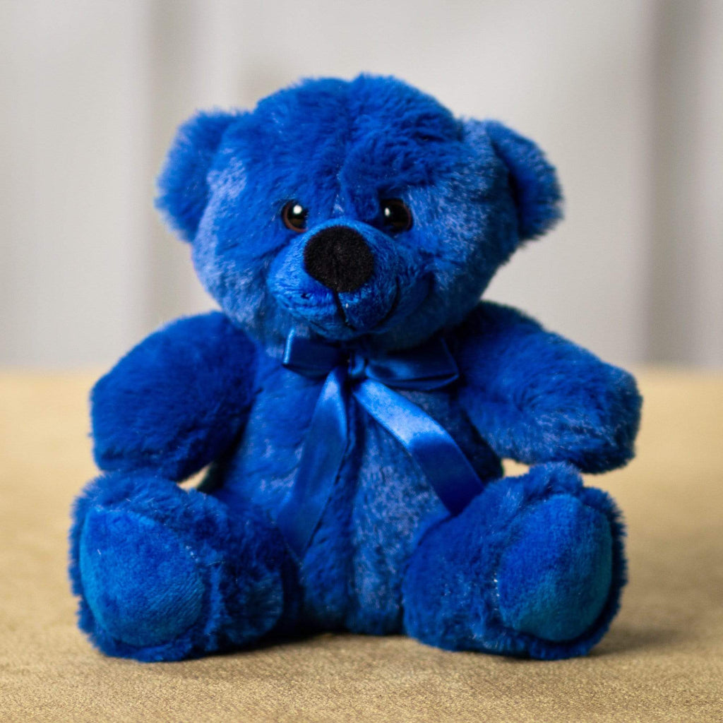 A dark blue bear that is 6 inches tall while sitting 