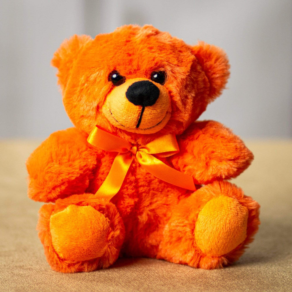 A orange bear that is 6 inches tall while sitting