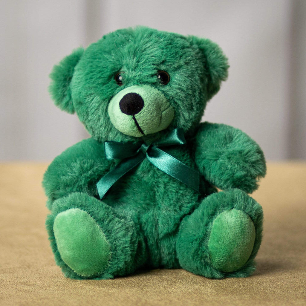 A green bear that is 6 inches tall while sitting 