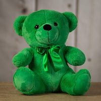 A green bear that is 14 inches tall while sitting wearing a matching bow