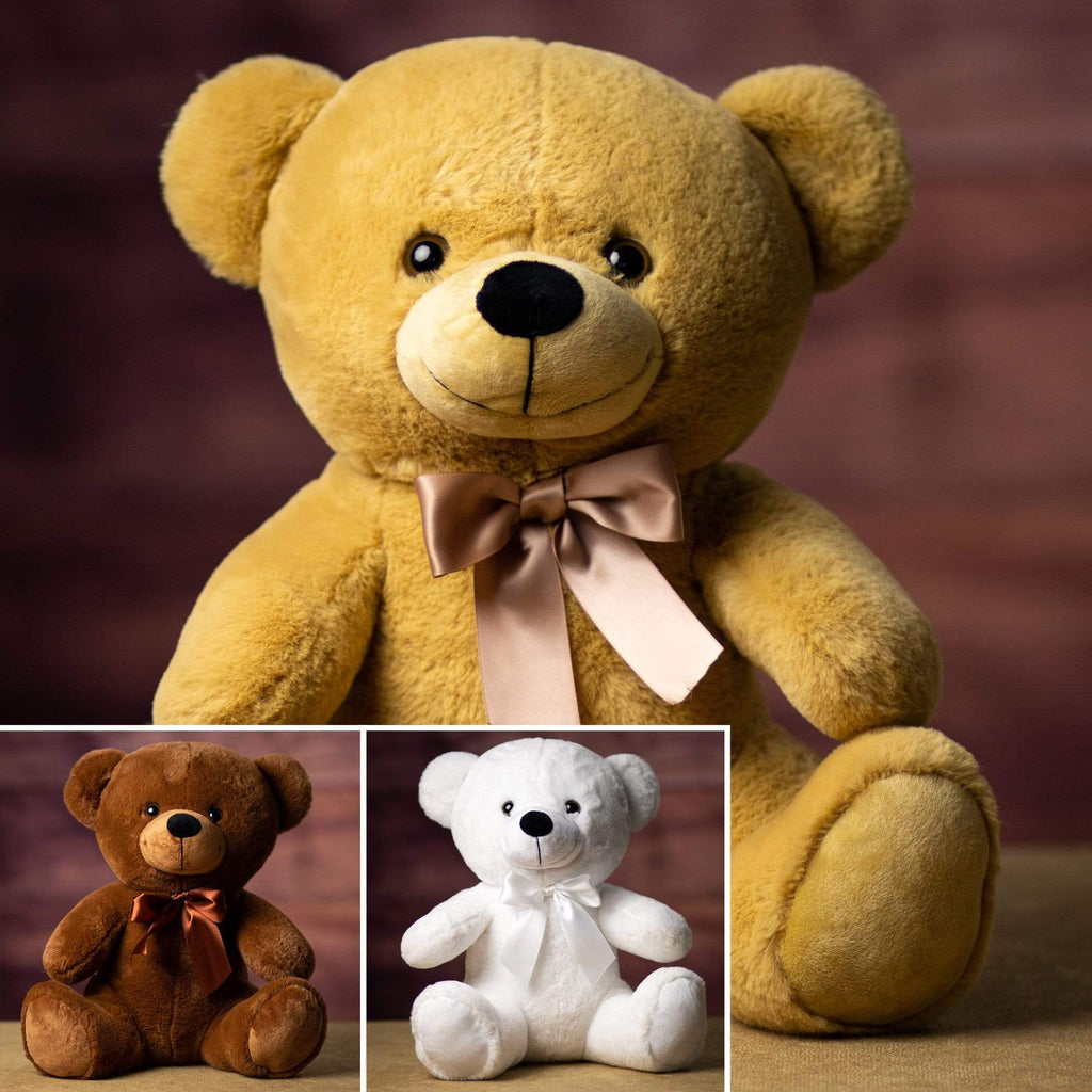 A brown, beige, and white bear that are 14 inches tall while sitting wearing a matching bow