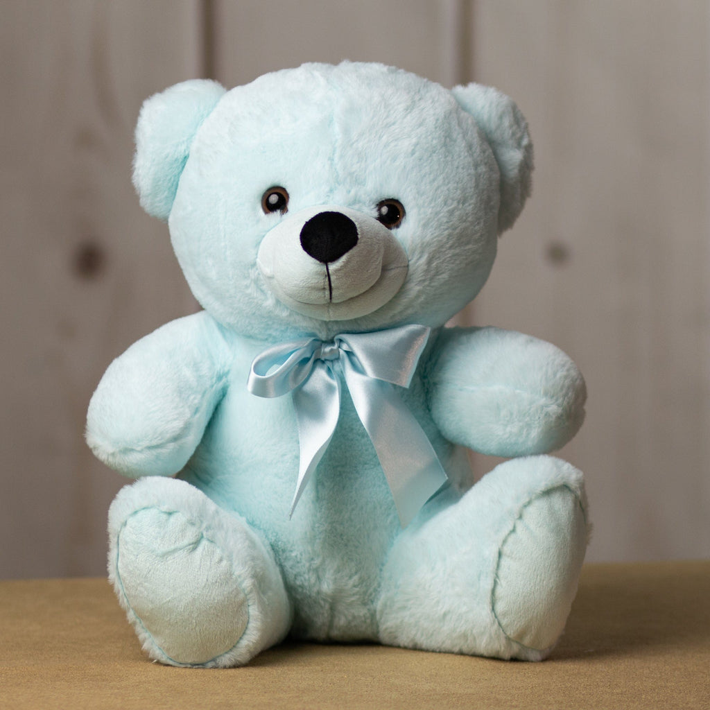 A light blue bear that is 14 inches tall while sitting wearing a matching bow