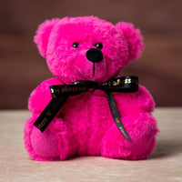 A hot pink bear wearing black ribbon
