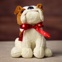 A bulldog wearing red ribbon