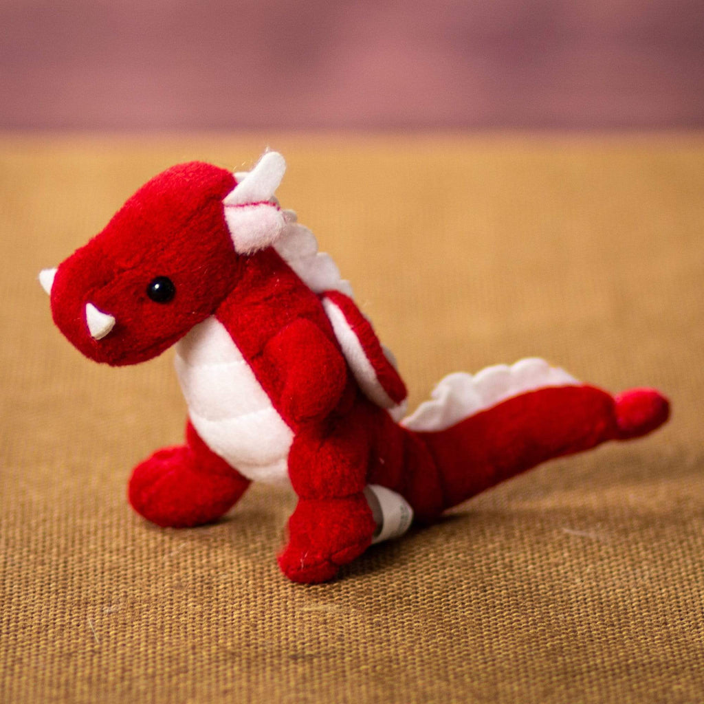 A red dragon that is 4 inches tall while standing