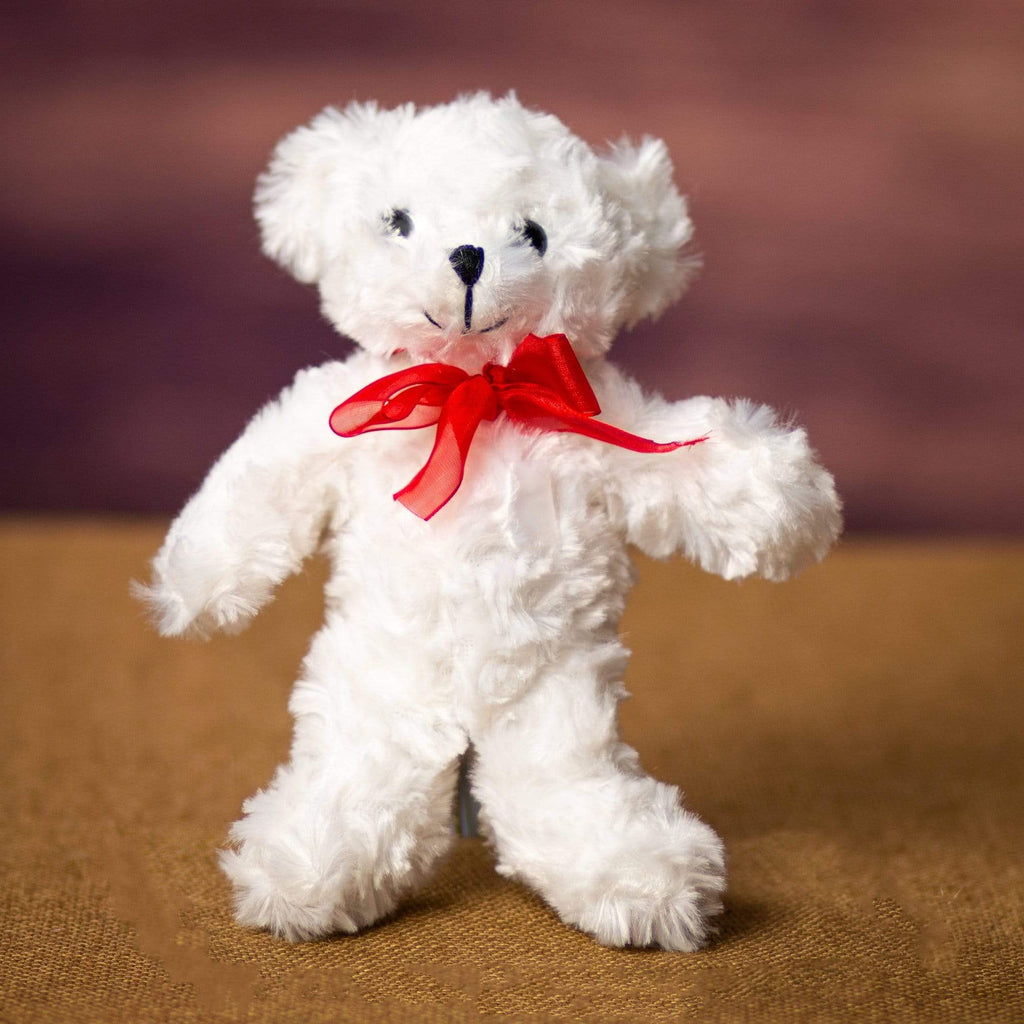A white bear that is 7.5 inches tall while standing