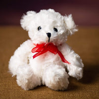 A sitting white bear that is 7.5 inches tall while standing
