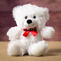 A white bear that is 10 inches tall while sitting