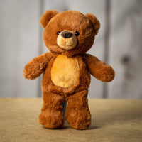 A brown bear that is 11 inches tall while standing