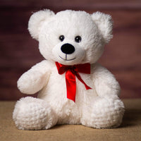 A white bear that is 10.5 inches tall while sitting