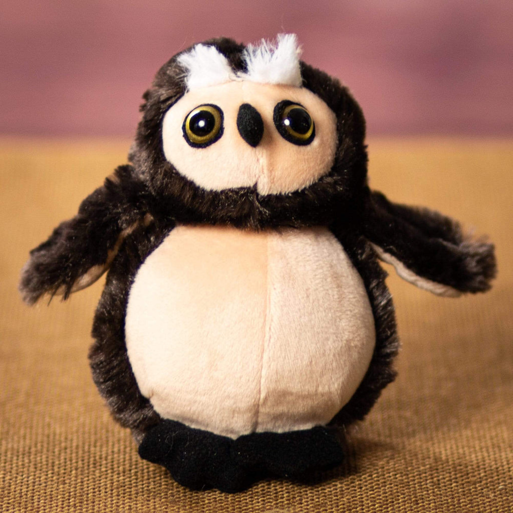 A stuffed owl that is 5 inches tall while sitting 
