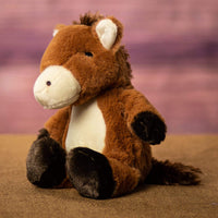 Side angle of a brown horse that is 11 inches tall while standing