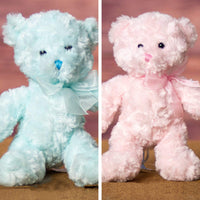 A light blue and pink bear that's 10 inches tall while standing 