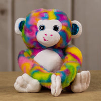 A psychedelic monkey that is 15 inches tall from head to toe with shiny blue ears and sparkle eyes