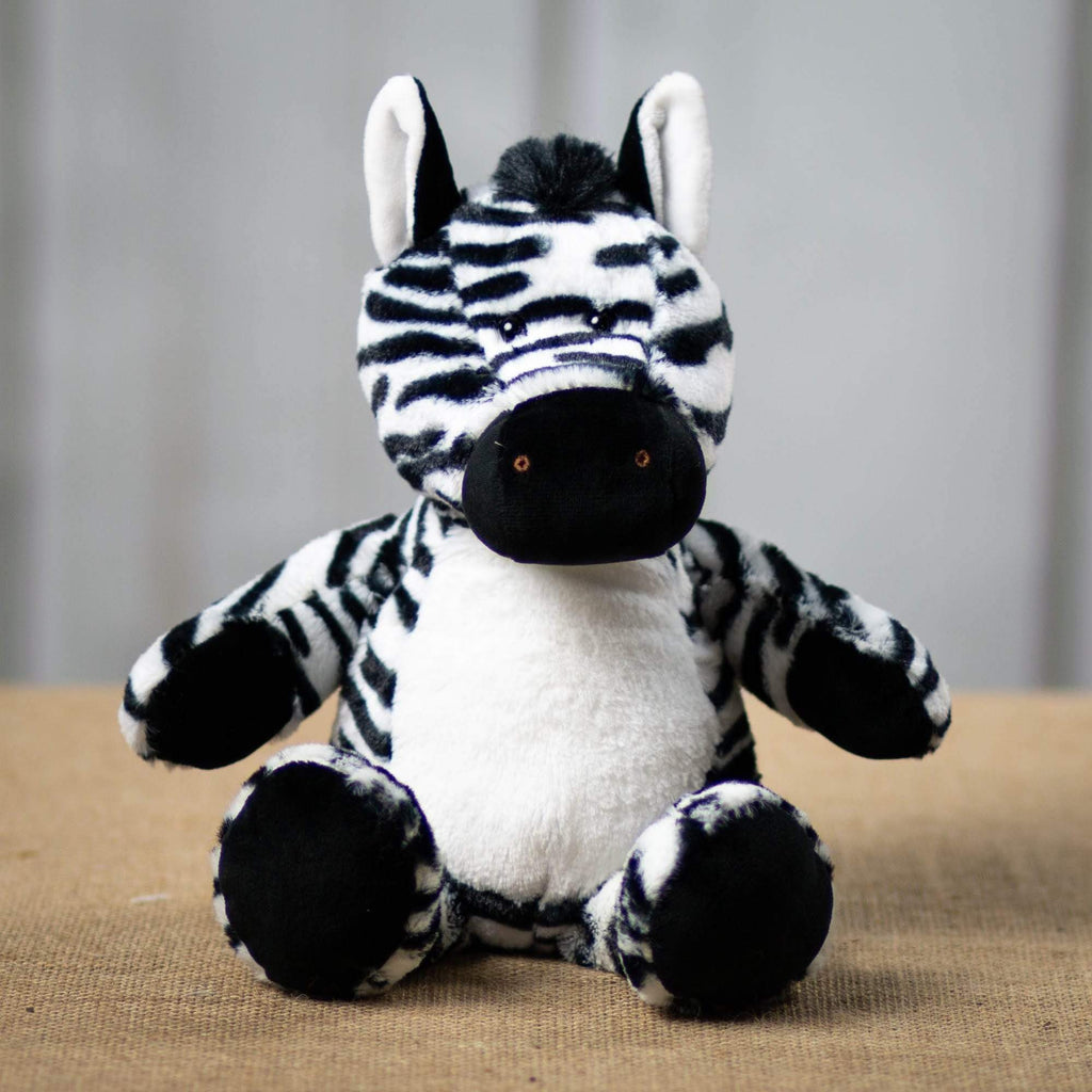 A black and white stripped zebra that is 13 inches tall while standing