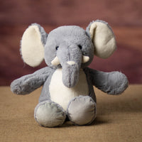 A gray elephant that is 13 inches tall while standing in a sitting position