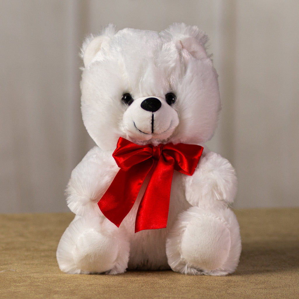 A white teddy bear that is 9 inches tall while sitting