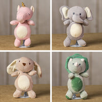 A pink unicorn, a gray elephant,  beige bunny, and a green dinosaur that are 10 inches tall while standing that has stripped stomach and ears