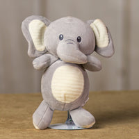 A gray elephant that is 10 inches tall while standing that has stripped stomach and ears