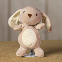 A beige bunny that is 10 inches tall while standing that has stripped stomach and ears