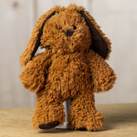 A brown scruffy rabbit that is 13 inches tall while standing with corduroy ears and feet