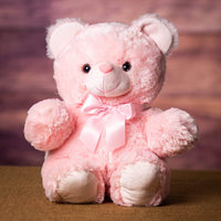 A pink bear that is 18 inches tall while standing