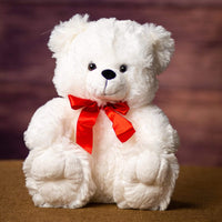 A white bear that is 12 inches tall while sitting