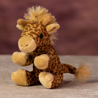 A spotted brown giraffe that is 5 inches tall while sitting