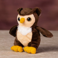 A stuffed owl that is 5 inches tall while sitting