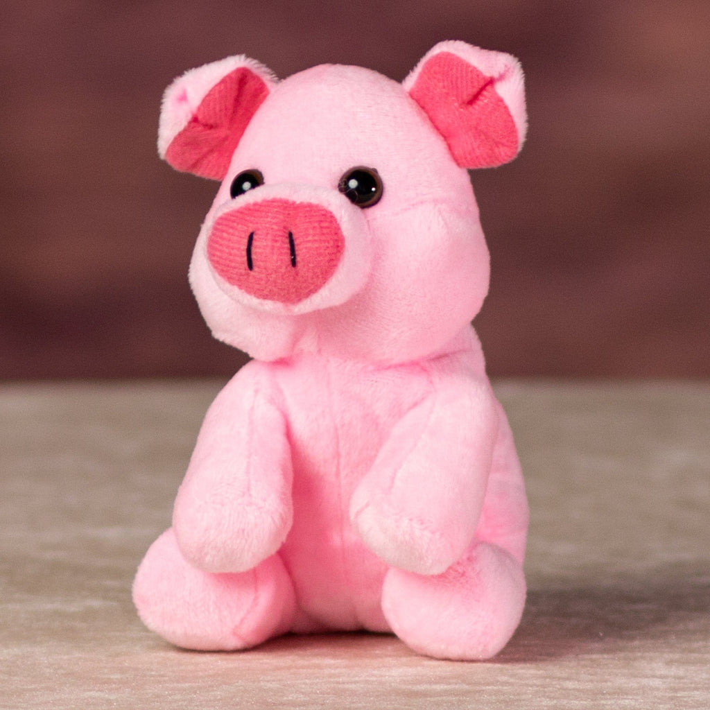 A sitting pink pig that is 5 inches tall 