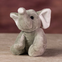 A gray elephant that is 5 inches tall while sitting