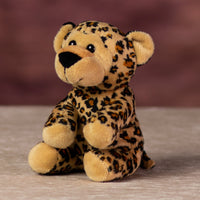 A spotted leopard that is 5 inches tall while sitting