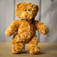 A beige bear that is 14 inches tall while standing