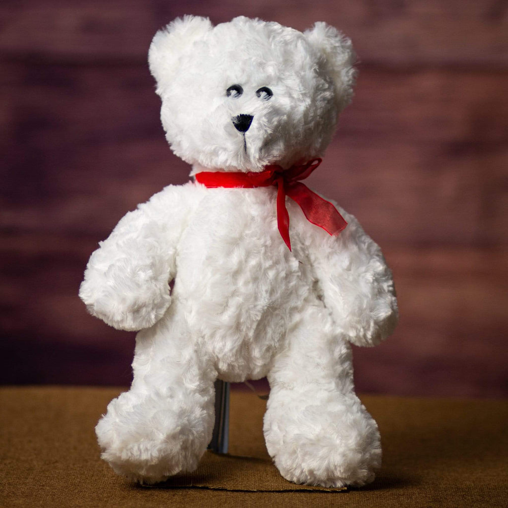 A white bear that is 14 inches tall while standing
