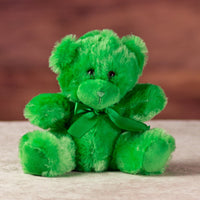 stuffed 6 in green bright and cheery bear with bow around her neck