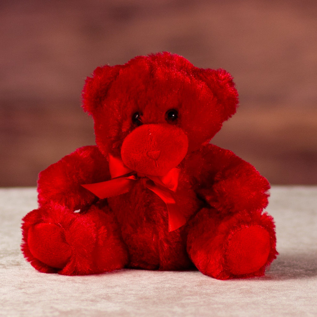 stuffed 6 in red bright and cheery bear with bow around her neck