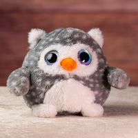 girl holding 8 in stuffed fluffy and spunky grey owl with sparkle eyes