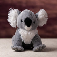 A white and gray koala that is 10 inches tall while sitting