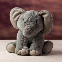 A gray elephant that is 10 inches tall while sitting