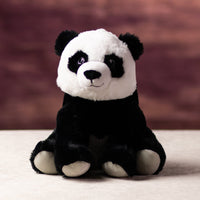 A black and white panda that is 10 inches tall while sitting