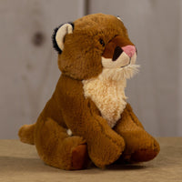 A brown cougar that is 10 inches tall while sitting