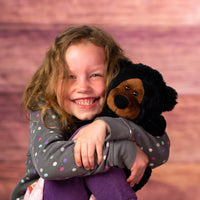 girl holding 10 in stuffed wild black bear