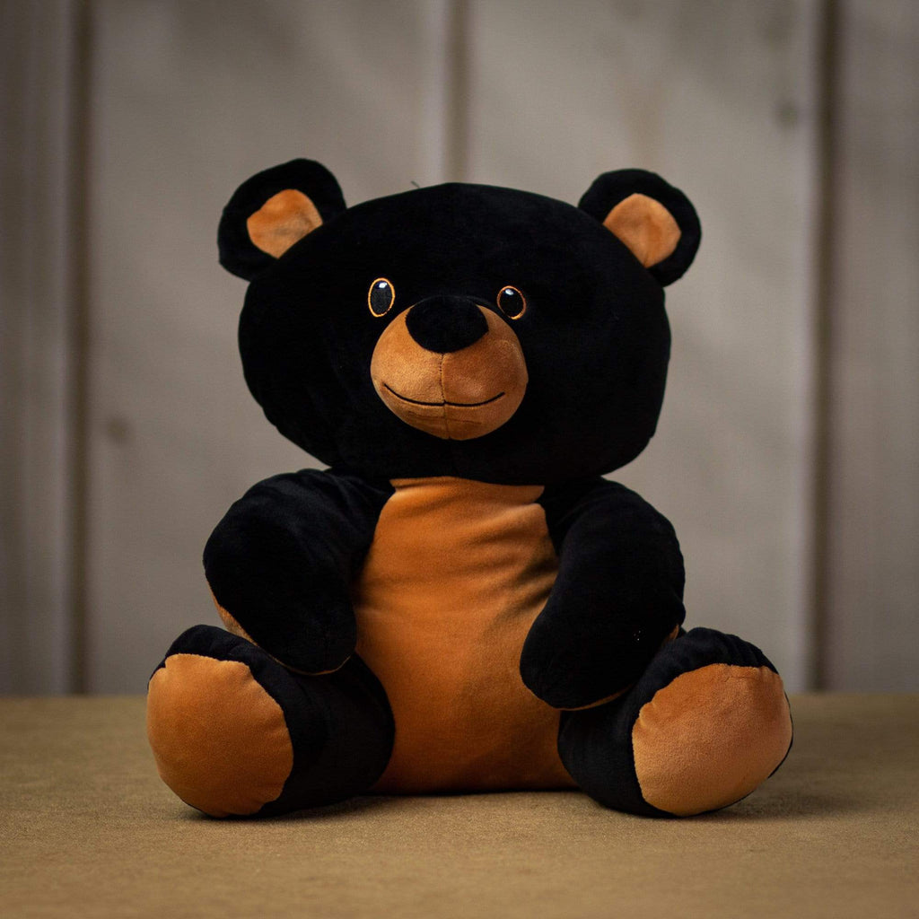 A black bear that is 12 inches tall while sitting