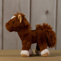 A brown horse that is 10.5 inches tall from head to tail