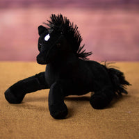 A black horse that is 9 inches from head to tail