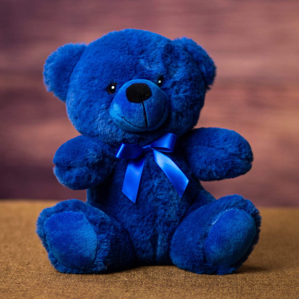 A dark blue bear that's 9 inches tall while sitting
