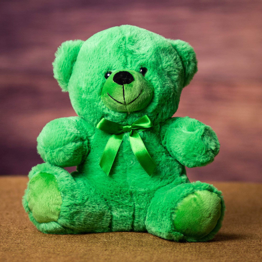 A green bear that is 9 inches tall while sitting