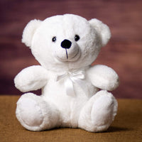 A white bear that is 9 inches tall while sitting 
